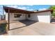 Wide driveway leading to a covered parking area at the front of the home at 2825 Hickey Ave, North Las Vegas, NV 89030