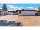Single story home with a covered parking area, and low maintenance landscaping at 2825 Hickey Ave, North Las Vegas, NV 89030