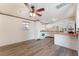 Kitchen with white cabinets, a breakfast bar, and modern appliances at 2825 Hickey Ave, North Las Vegas, NV 89030