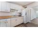 Kitchen featuring white cabinets, retro countertops, and ample storage space at 2825 Hickey Ave, North Las Vegas, NV 89030