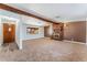 Open living room features a brick fireplace and carpeted flooring at 2825 Hickey Ave, North Las Vegas, NV 89030