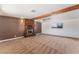 Spacious carpeted living room featuring a brick fireplace and ceiling fan at 2825 Hickey Ave, North Las Vegas, NV 89030