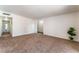 Open living area with neutral tones and access to various parts of the home at 2825 Hickey Ave, North Las Vegas, NV 89030