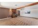 Spacious carpeted living room featuring a brick fireplace and ceiling fan at 2825 Hickey Ave, North Las Vegas, NV 89030