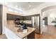 Stylish kitchen with granite countertops, stainless steel appliances, gray cabinets, and hardwood flooring and an open floorplan at 3300 Uribe St, Las Vegas, NV 89129