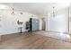 Bright and airy living room featuring modern lighting, sleek flooring, and minimalist decor with views to other rooms at 3300 Uribe St, Las Vegas, NV 89129