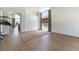 Open-concept living space with light wood floors, neutral walls, and large windows for plenty of natural light at 3300 Uribe St, Las Vegas, NV 89129
