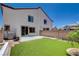 The Backyard features artificial turf, a patio, and a view of the home's exterior at 3365 Moon Eclipse St, North Las Vegas, NV 89032