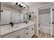 Modern bathroom featuring double sinks, granite countertops, and a separate tub with tile surround at 3365 Moon Eclipse St, North Las Vegas, NV 89032