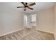 Well-lit bedroom with a ceiling fan and adjacent closet and bathroom entrances at 3365 Moon Eclipse St, North Las Vegas, NV 89032