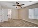 Cozy bedroom featuring a ceiling fan and easy access to closet and bathroom at 3365 Moon Eclipse St, North Las Vegas, NV 89032
