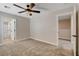 Bedroom with a ceiling fan and easy access to both closet and bathroom areas at 3365 Moon Eclipse St, North Las Vegas, NV 89032