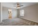 Bright bedroom features a ceiling fan and convenient ensuite bathroom access at 3365 Moon Eclipse St, North Las Vegas, NV 89032