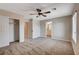 Comfortable bedroom with ceiling fan, closet, and ensuite bathroom access at 3365 Moon Eclipse St, North Las Vegas, NV 89032