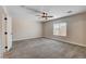 Bedroom with a ceiling fan and natural light streaming through a window at 3365 Moon Eclipse St, North Las Vegas, NV 89032