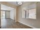 Bright dining area featuring laminate flooring and a window with backyard views at 3365 Moon Eclipse St, North Las Vegas, NV 89032