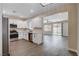Open kitchen boasts white cabinets, modern appliances, and seamless flow to the living area at 3365 Moon Eclipse St, North Las Vegas, NV 89032