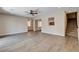 Spacious living area featuring modern flooring, neutral walls, and staircase access at 3365 Moon Eclipse St, North Las Vegas, NV 89032