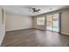 Bright living room with laminate flooring and sliding door access to the backyard at 3365 Moon Eclipse St, North Las Vegas, NV 89032