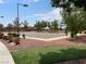 Community basketball court surrounded by lush trees, offering a great outdoor recreation space at 3425 Fledgling Dr, North Las Vegas, NV 89084