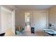 Neutral bedroom with door to the bathroom, closet, and baby swing, offering flexibility for any decor at 3425 Fledgling Dr, North Las Vegas, NV 89084