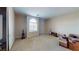 Spacious bedroom featuring neutral walls, carpet flooring, and a large window providing ample natural light at 3425 Fledgling Dr, North Las Vegas, NV 89084