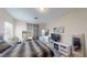 Bright bedroom boasts a modern bed, sleek furniture, soft gray accents, and ample lighting for a serene retreat at 3425 Fledgling Dr, North Las Vegas, NV 89084