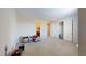 Large bedroom with neutral carpeting, bright walls, closet with double doors and access to bathroom at 3425 Fledgling Dr, North Las Vegas, NV 89084