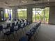 Conference room with rows of chairs, large windows and hanging lights at 3425 Fledgling Dr, North Las Vegas, NV 89084
