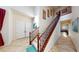 Grand foyer showcases soaring ceilings, tile floors, and an elegant staircase leading to the second level at 3425 Fledgling Dr, North Las Vegas, NV 89084