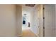 Upstairs hallway featuring neutral carpet, bright walls, and doors to bedrooms creating an airy, open feel at 3425 Fledgling Dr, North Las Vegas, NV 89084