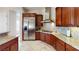 Beautiful kitchen with stainless steel appliances, granite countertops, and wooden cabinetry at 3425 Fledgling Dr, North Las Vegas, NV 89084