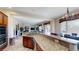 Spacious kitchen with granite countertops, breakfast bar, and stainless steel appliances at 3425 Fledgling Dr, North Las Vegas, NV 89084