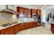 Modern kitchen with stainless steel appliances, granite countertops, and wood cabinets at 3425 Fledgling Dr, North Las Vegas, NV 89084