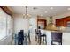 Open kitchen with stainless steel appliances, granite countertops, and wooden cabinetry at 3425 Fledgling Dr, North Las Vegas, NV 89084
