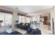 Spacious living area opens to kitchen, featuring tile floors and ample natural light at 3425 Fledgling Dr, North Las Vegas, NV 89084
