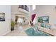 Bright living room features soaring ceilings, comfortable seating, and a formal dining area at 3425 Fledgling Dr, North Las Vegas, NV 89084
