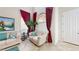 Bright living room features soaring ceilings, comfortable seating, and an abundance of natural light at 3425 Fledgling Dr, North Las Vegas, NV 89084