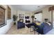 Comfortable living room features fireplace and view of the dining area at 3425 Fledgling Dr, North Las Vegas, NV 89084