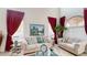 Bright living room features soaring ceilings, comfortable seating, and an abundance of natural light at 3425 Fledgling Dr, North Las Vegas, NV 89084