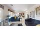 Open floor plan showcases living room connected to the kitchen and dining area at 3425 Fledgling Dr, North Las Vegas, NV 89084