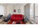 Office space featuring a red sofa, desk area, and comfortable furnishings at 3425 Fledgling Dr, North Las Vegas, NV 89084