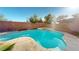 Inviting pool and spa surrounded by lush landscaping creating a private backyard oasis at 3425 Fledgling Dr, North Las Vegas, NV 89084