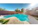 Inviting pool and spa surrounded by lush landscaping and a serene backyard setting at 3425 Fledgling Dr, North Las Vegas, NV 89084