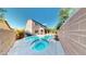 Lush backyard with pool, spa, and lush landscaping, perfect for outdoor enjoyment at 3425 Fledgling Dr, North Las Vegas, NV 89084