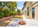 Spacious backyard with a fire pit, lush landscaping, and a patio area perfect for outdoor entertaining at 4007 W Red Coach Ave, North Las Vegas, NV 89031