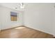 Bedroom featuring hardwood floor, bright lighting, and ample space at 4007 W Red Coach Ave, North Las Vegas, NV 89031