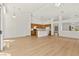 Spacious living room boasts vaulted ceilings, light wood floors and an open layout with kitchen and archway access at 4007 W Red Coach Ave, North Las Vegas, NV 89031