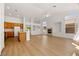 Bright, open living space with hardwood floors, fireplace, and kitchen with wood cabinets at 4007 W Red Coach Ave, North Las Vegas, NV 89031