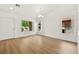 Bright living room with wood-look floors, natural light, and an open, airy atmosphere at 4007 W Red Coach Ave, North Las Vegas, NV 89031
